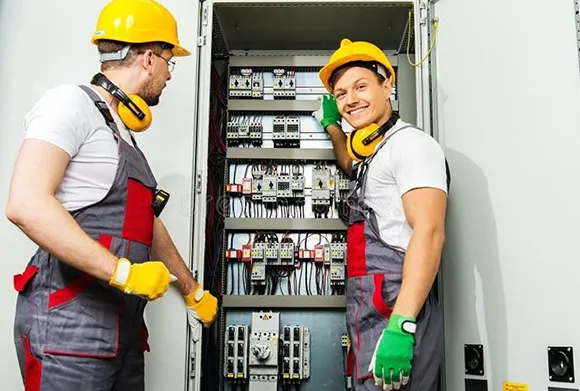 Electricians performing routine commercial electrical maintenance to ensure system safety and efficiency.